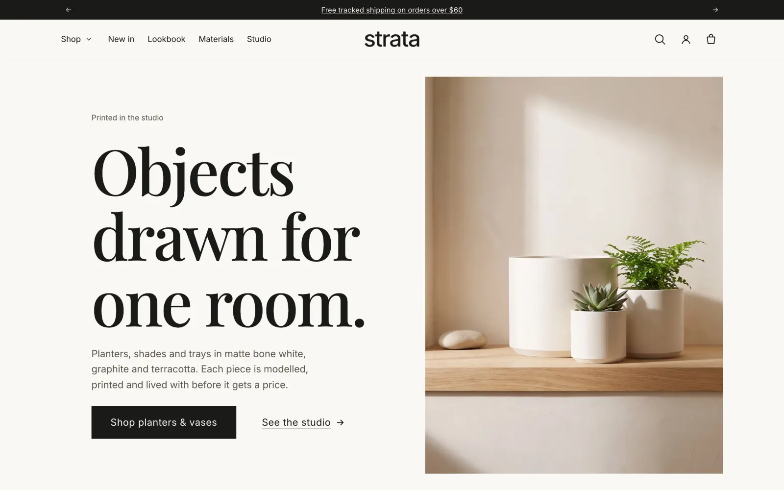 Strata preset home page: a serif headline beside white printed planters on an oak shelf